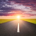 Driving on an empty road at sunsrise Royalty Free Stock Photo