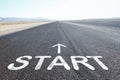 Driving on an empty road towards blue sky with sign start on asphalt