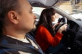 Driving female student trying to let car moving Royalty Free Stock Photo