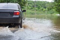 Driving through flood water Cramped on the road, heavy rains cause wild water to flood the road,motion blur,overuse of noise