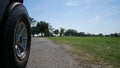 Driving a golf cart in golf course.