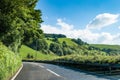 Driving through the green hills and pastures of rural England.