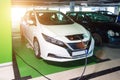 Driving hybrid. Hybrid vehicle - green technology of future. Electric car charge battery on eco energy charger station. Power Royalty Free Stock Photo