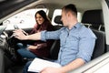 Driving Instructor and Woman Student in Examination Car Royalty Free Stock Photo