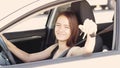 Driving instructor, student driver at a driving school takes an exam in a car to obtain a driver`s license