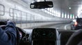 Driving in Lincoln tunnel, New York. Close up view on cab driver hand and dashboard Royalty Free Stock Photo