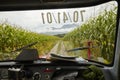 Car windscreen road corn field