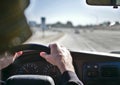 Driving on Los Angeles California freeways in mild traffic with a dirty windshield.