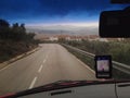 Driving by narrow mountain curvy road a rainy day Royalty Free Stock Photo