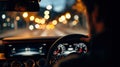 Driving At Night With Blurred City Lights. Focus On Dashboard And Steering Wheel Royalty Free Stock Photo