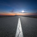 Driving on open road towards the mountain at dawn Royalty Free Stock Photo