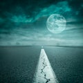 Driving on open road towards the super moon at night Royalty Free Stock Photo