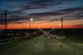 Driving over a bridge early morning at sunrise