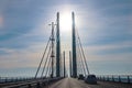Driving over the Oresund bridge between Denmark and Sweden with the rising sun trough the bridge Royalty Free Stock Photo