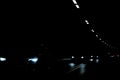 Driving in a pitch black tunnel inside a mountain Royalty Free Stock Photo