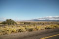 Driving plate side view moving through desert in car with motion blur