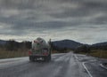 Driving in rain. Rainy road with liquid truck.