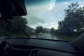 driving in the rain, the windshield splattered with raindrops, working wipers Royalty Free Stock Photo