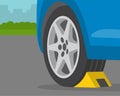 Driving rules and tips. Close-up view of wheel stopper or chocks. Royalty Free Stock Photo