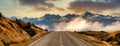 Driving the scenic road towards the Southern Alps shrouded in low cloud in Aoraki Mt Cook national park