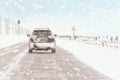 Driving in snow storm on bad winter Road Royalty Free Stock Photo