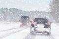 Driving in snow storm on bad winter Road Royalty Free Stock Photo