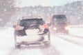 Driving in snow storm on bad winter Road Royalty Free Stock Photo