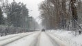 Driving in a snowstorm in the countryside from the Netherlands Royalty Free Stock Photo