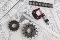 Driving sprockets, caliper, chain, micrometer and engineering drawings