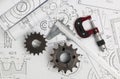 Driving sprockets, caliper, micrometer and engineering drawings Royalty Free Stock Photo