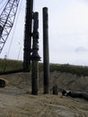 driving tubular piles into the ground using a pile driver