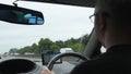 Driving in the UK. Car inside view, focus on dashboard