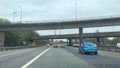 Driving under bridges motorway M60. Incident on road. Speed restriction.