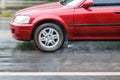 Heavy rain, cars driving on a flooded road during a flood, Royalty Free Stock Photo