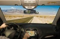 Driving using GPS on a desert road, Death Valley, USA Royalty Free Stock Photo