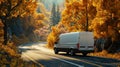 Driving white delivery van with autumn trees in the background on a highway Royalty Free Stock Photo