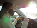 Driving woman with protective mask Royalty Free Stock Photo