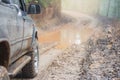 Driving a 4x4 car on a muddy road during the rainy season, Off-r Royalty Free Stock Photo