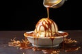 drizzling caramel or chocolate sauce on ice cream
