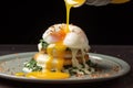 drizzling hollandaise sauce over poached eggs