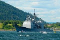 People in motorboats follow norwegian military ship in a fjord in Drobak, Norway.