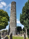 Drogheda, IRELAND - August 5h, 2019: Celtic High Cross in the historic ruins of Monasterboice, an early Christian settlement near Royalty Free Stock Photo