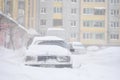 Drohobych, Ukraine - March15, 2013: Mercedes-benz and other cars blocked by snow, snow-paralysis of traffic, snow covered street,