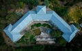 Drone aerial of an abandoned hotel building in the forest. Deserted places outdoor.