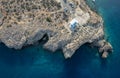 Drone aerial Cape Greko peninsula. Agioi Anargyroi church on the rocks. Cruise touristic boats sailing Cyprus. Royalty Free Stock Photo