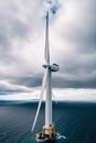 drone aerial close up view of Windmill in the ocean in a sunny day.AI Generated