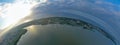 Drone Aerial 360 Degree Panoramic Curved View on Touristic City Located on Spit between Sea and Lake