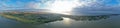 Drone Aerial 360 Degree Wide Panoramic View on Touristic City Located on Spit between Sea and Lake