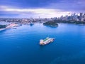 Drone Aerial view of Sydney Harbour Sydney CBD NSW Australia. cloudy dark skies, clear turquoise waters. Royalty Free Stock Photo