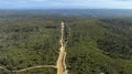 Drone aerial photograph of a dirt road running through a lush green forest in the Blue Mountains in New South Wales in Australia Royalty Free Stock Photo